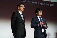 左からプレゼンターの田中千義、山本二三の代理で登壇した山本鷹生氏