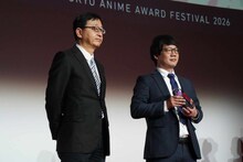 左からプレゼンターの田中千義、山本二三の代理で登壇した山本鷹生氏