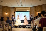 「バーティア様を愛でる会主催“自称悪役令嬢な婚約者の観察記録。”アニメ第11話・最終話先行上映会inチャペルですわ！」イベントの様子。左から小林裕介、富田美憂、宮本侑芽、山元隼一監督