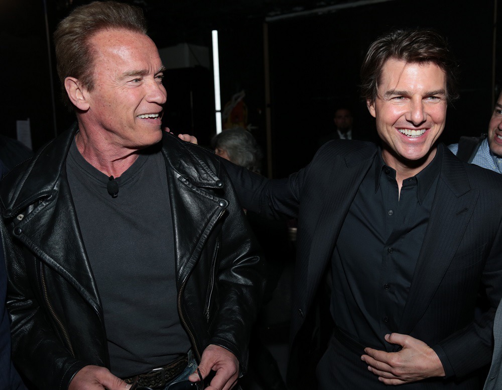 左からアーノルド・シュワルツェネッガー、トム・クルーズ。(c)ABImages