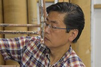 この道38年の手描き看板職人、北原邦明氏。