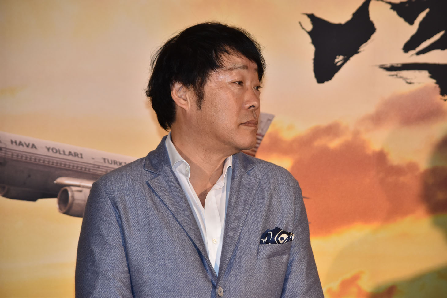 監督の田中光敏。