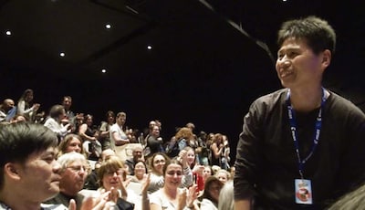 アヌシー国際アニメーション映画祭の舞台挨拶に登壇した高坂希太郎。