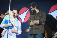 ダニエル・ローガン（左）の子供を見つめるラーナー・ダッグバーティ（右）。