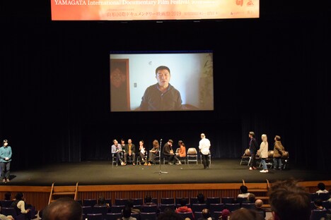 山形国際ドキュメンタリー映画祭2019の表彰式では、ワン・ビンによるビデオメッセージが上映された。（写真提供：山形国際ドキュメンタリー映画祭）
