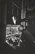 「ジャズ・ロフト」 W. Eugene Smith at the Jazz Loft window, 1959. Credit: Self-portrait, W. Eugene Smith, (c) 1959 The Heirs of W. Eugene Smith.
