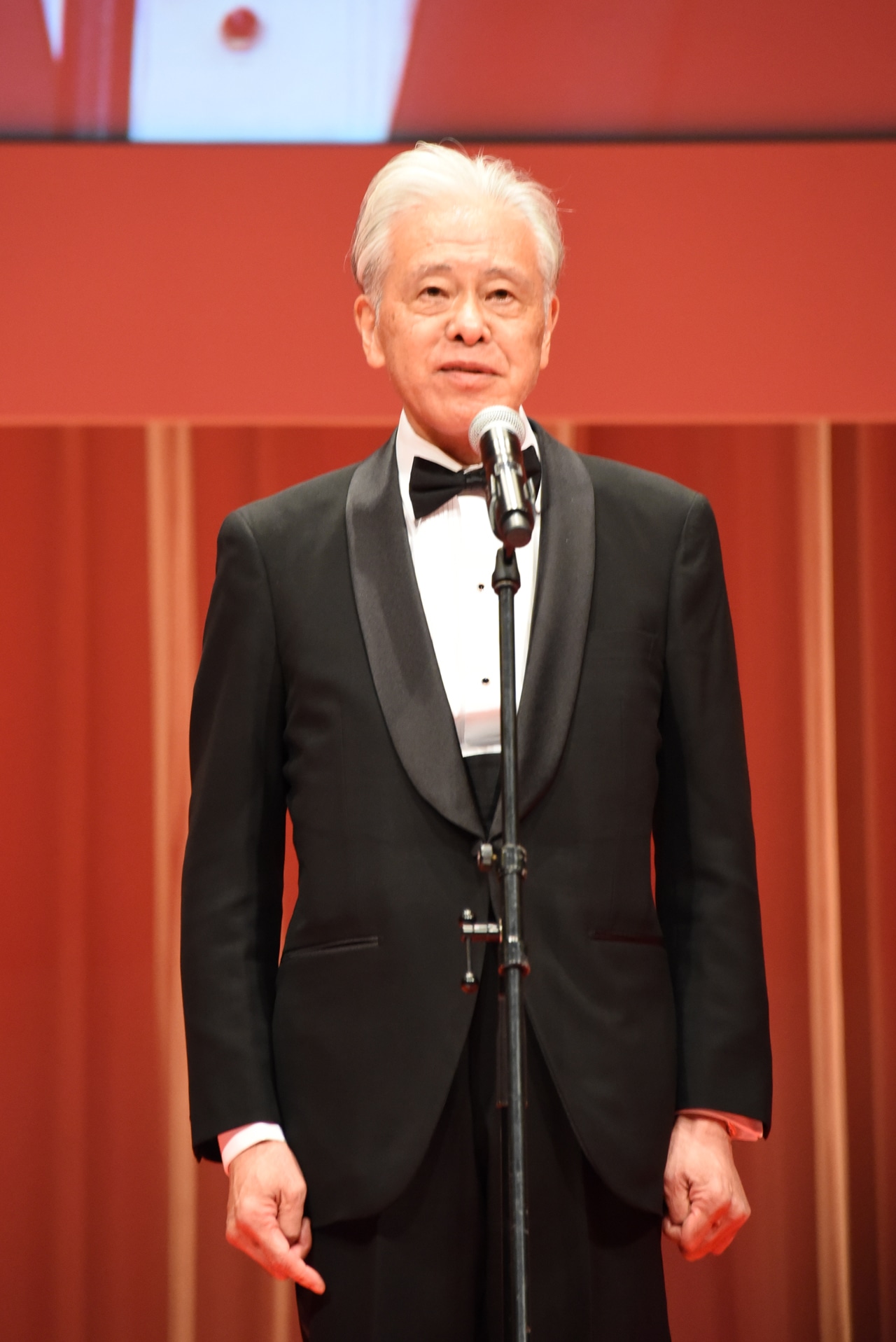 チェアマンの安藤裕康。