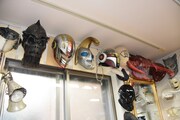百武スタジオの事務所にて。百武が携わった作品に登場するマスクなど。