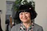 太田裕子役の野口かおる。