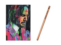 入場者特典のアートポストカード（左）と復刻版・JW伝説の鉛筆（右）。