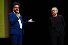 左からホアキン・コシーニャ、山村浩二。