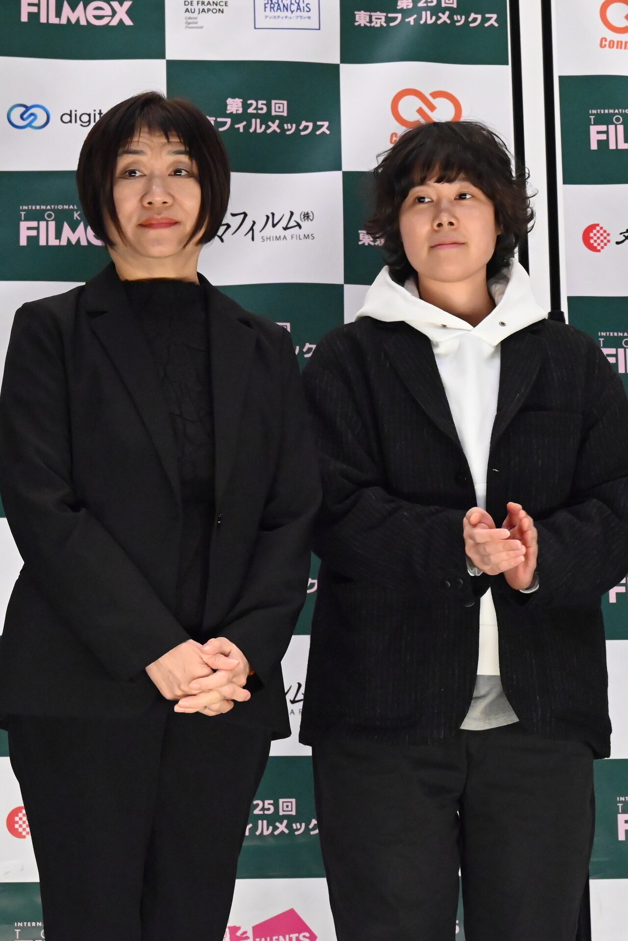 未完成の映画」のプロデューサー兼脚本担当のマー・インリー（左