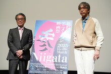 左から井上伸一郎、石川光久