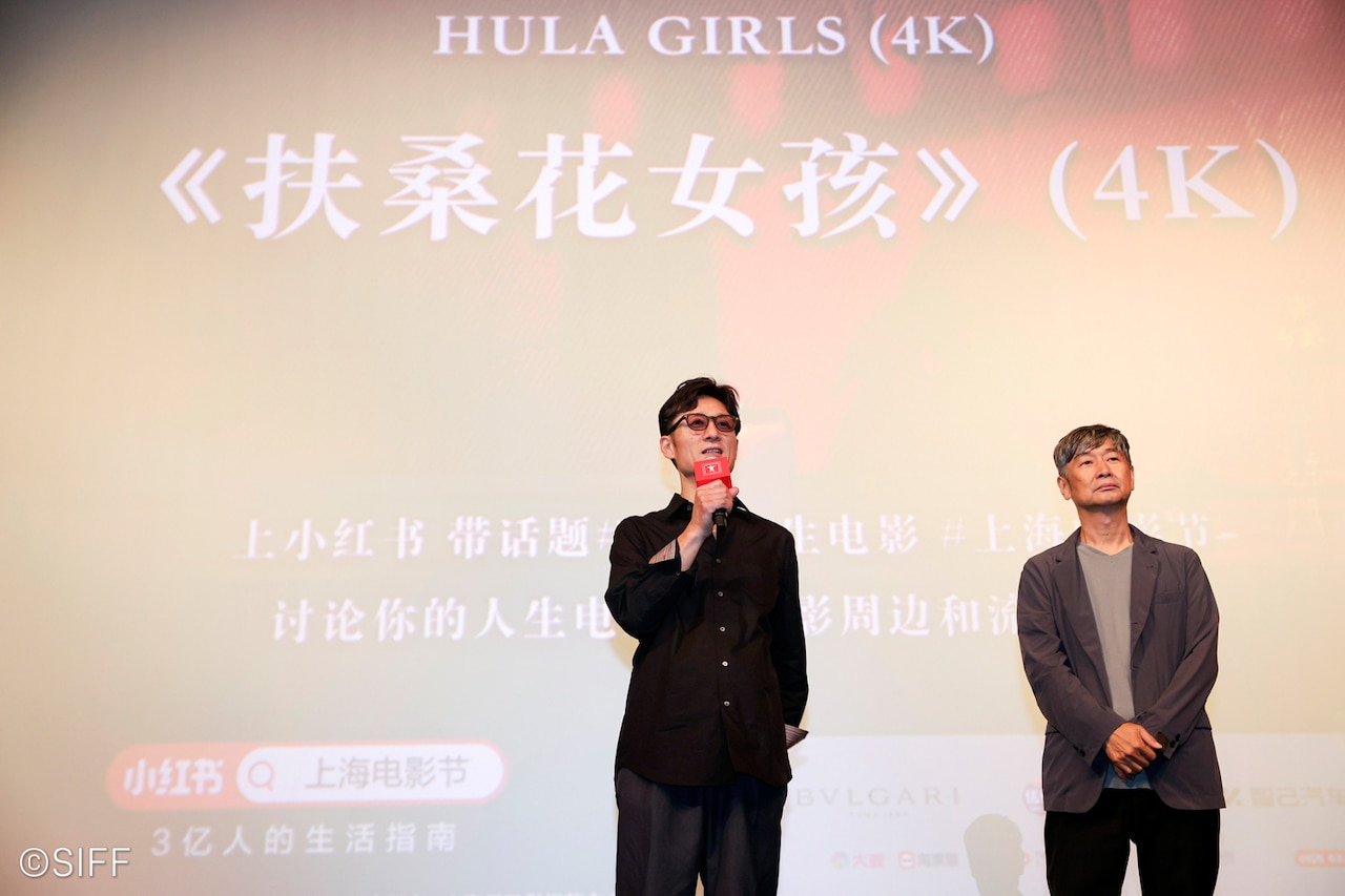 左から李相日、種田陽平