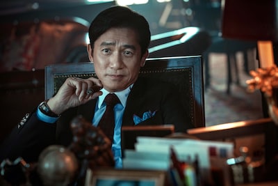 トニー・レオン演じる金融詐欺の国際指名手配犯ダイ・イーチェン