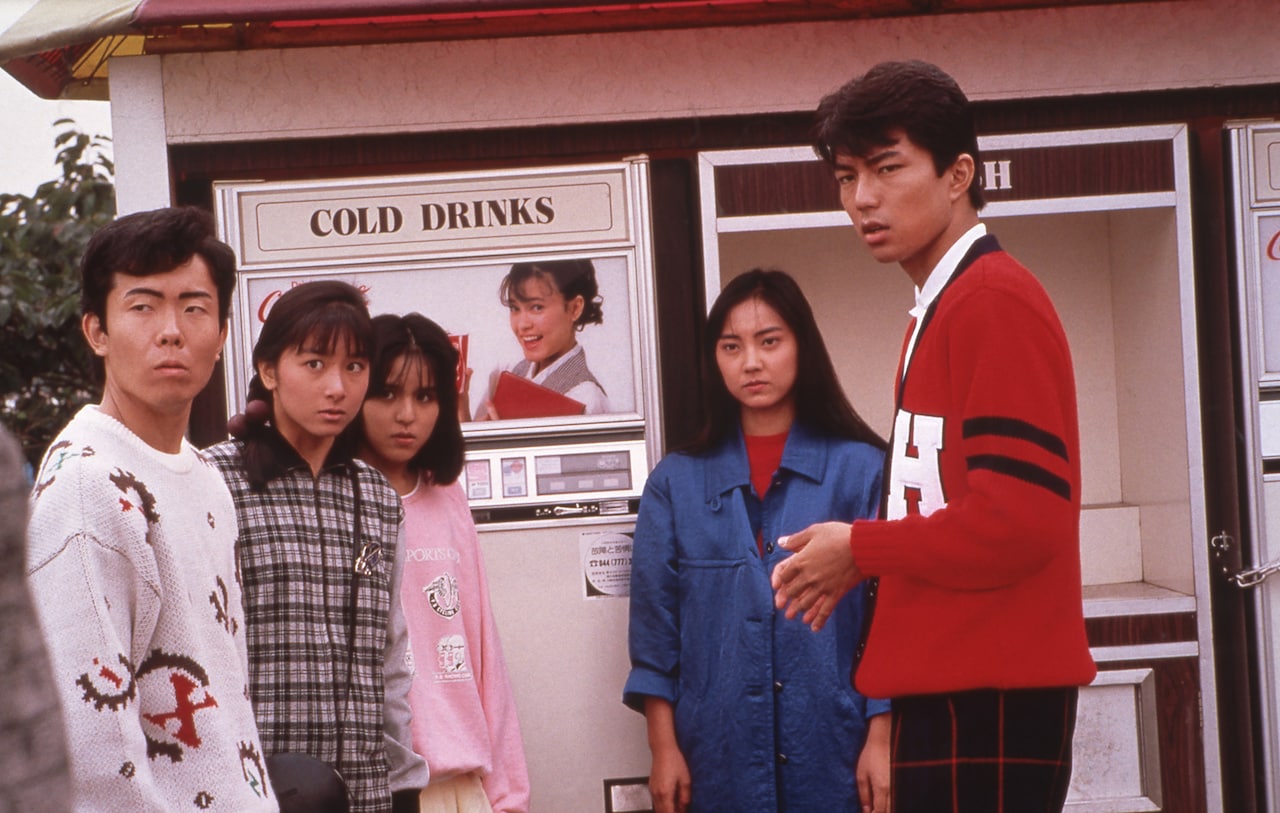 映画4作目「ビー・バップ・ハイスクール 高校与太郎狂騒曲」より。当時の流行ファッションであるアイビールックのトオル（右）