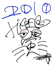 写真は髭（HiGE）メンバーによる直筆メッセージ。2010年の干支である「寅」の文字もしっかり記されている。