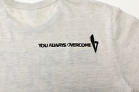 写真はチャリティTシャツの背中のデザイン。