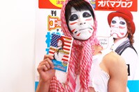 自著を手に満足げな表情の樽美酒研二。