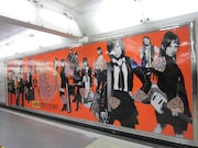 ギターピックが貼られた「GIVE ME FIVE!」大型ポスター。