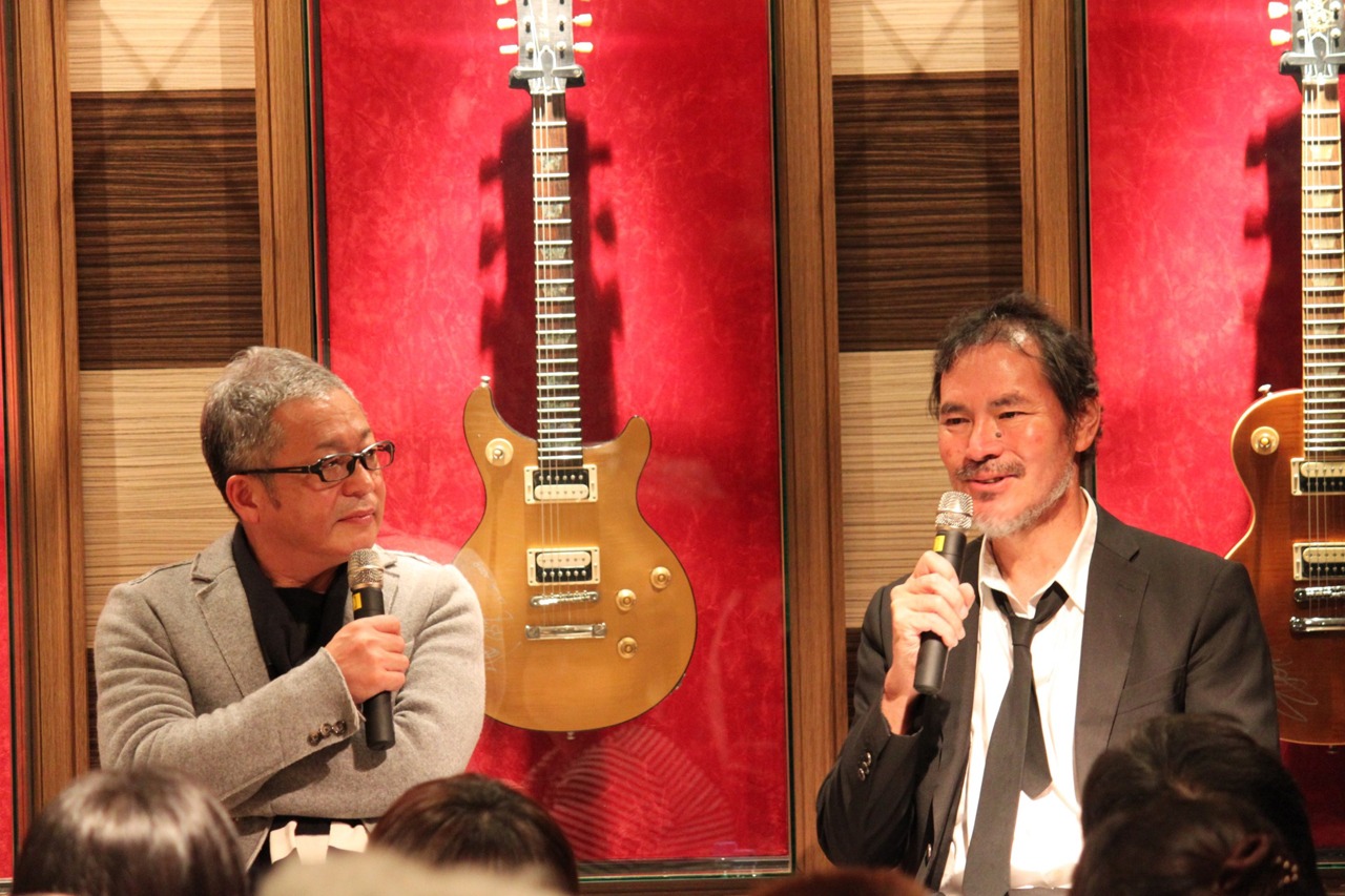 左から大間ジロー、柿崎譲志氏。