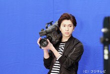 カメラマンに扮したコーイチ。