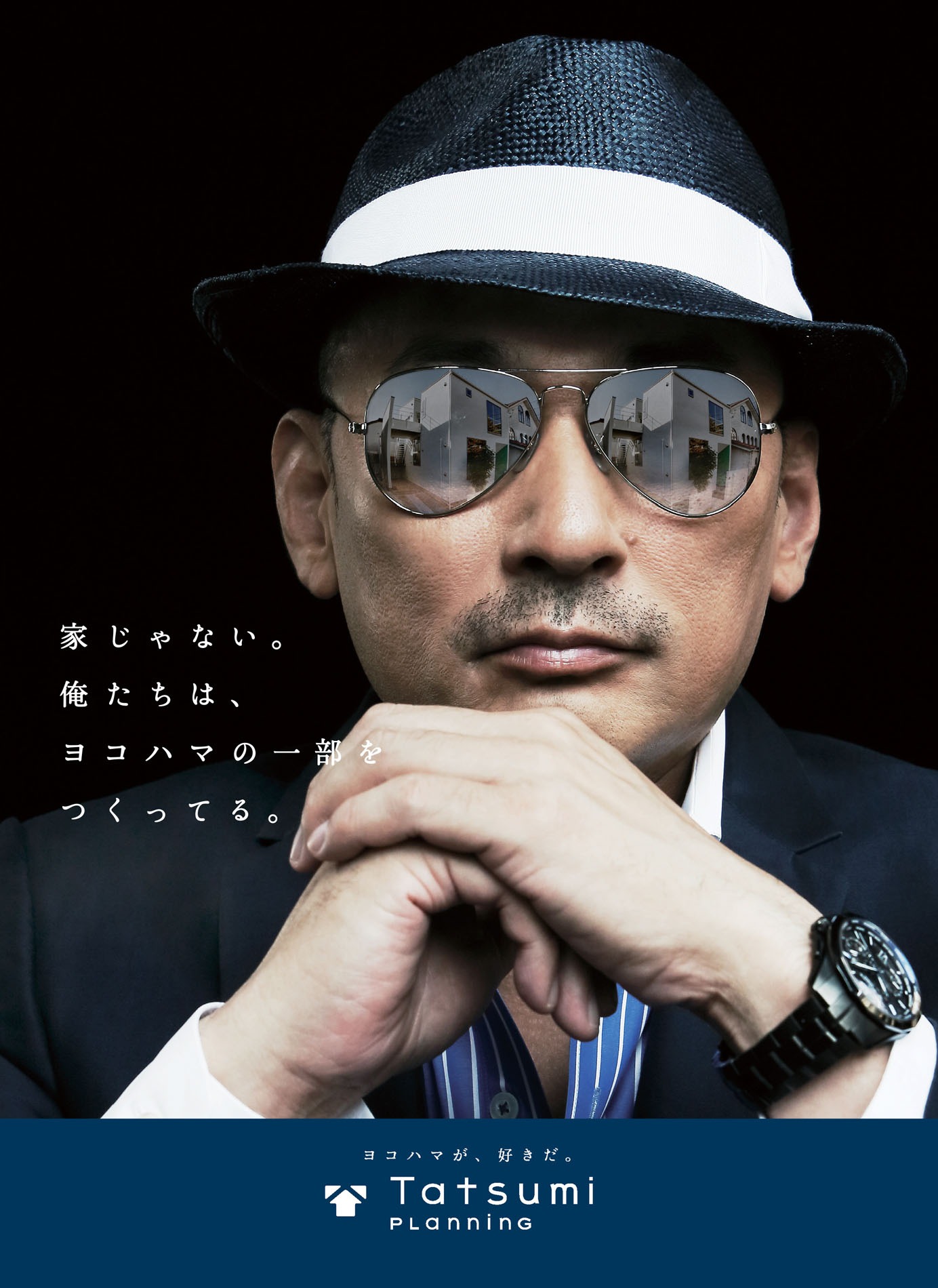 横山剣（クレイジーケンバンド）がイメージキャラクターを務める「タツミプランニング」のポスター。
