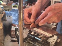 「コメニケーション」広告制作中の様子。