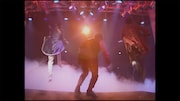 「DRAGON THE FESTIVAL TOUR featuring TM NETWORK 1985.10.31」のワンシーン。