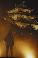 名古屋城の前に立つAK-69。