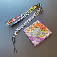 Tempalay「Q / 憑依さん」天国盤付属のネックストラップと“超小型おばけ探知機 ばけたん Tempalay ver.”。
