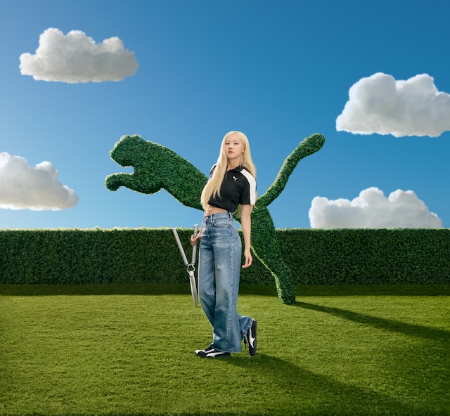 プーマH-STREETのキャンペーンビジュアル。プーマロゴに整えられた木の前で、ロゼが刈込はさみを手にしている。