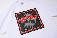 SCARS「THE ALBUM」のジャケットデザインを用いたTシャツ。