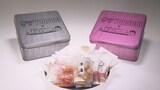 YOASOBI×もち吉×「地元検証バラエティ 福岡くん。」コラボ缶のイメージ。