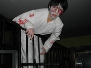 「リンカーンお化け屋敷」で柵から身を乗り出すお化け。