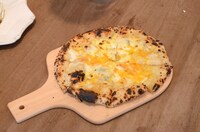 報道陣に振る舞われたピザの一例。