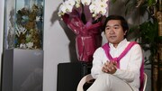 告知動画に登場する小石田純一。