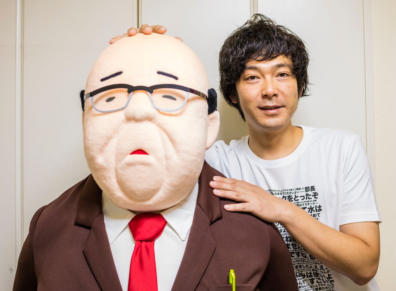 マンガ「サラリーマン山崎シゲル」に登場する部長と作者のタナカダファミリア。