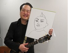 お相手の似顔絵を披露する松浦真也。