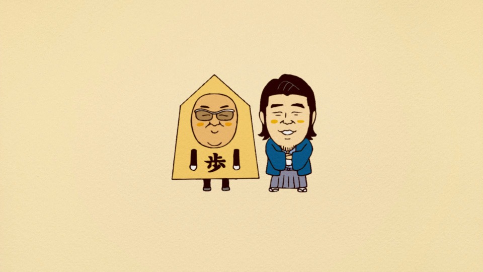 将棋駒に扮したサンドウィッチマン伊達（左）と、棋士に扮したサンドウィッチマン富澤（右）。