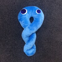 「よだれだこキャッチャー」に投入されたキャラクター「よだれだこ」。