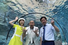 錦鯉と田口彩夏アナ。