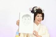 お相手”たくちゃん”の似顔絵を披露する八幡カオル。