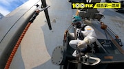 1号機の建屋外壁にプレートを設置する様子。(c)NHK