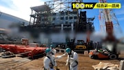 1号機建屋付近での作業の様子。(c)NHK