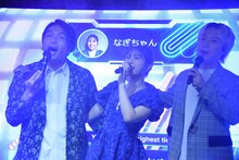 肩を組んで歌う見取り図と渋谷凪咲