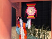 玉蓮が指し示すのは、朱色×からし色の提灯。まるで玉蓮が、不思議な力で宙に浮かしているかのような1枚。