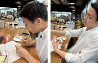 花嫁さんの綿帽子に色をつける米吉。職人さんのような真剣な表情。