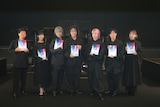 「朗読劇 READING WORLD ユネスコ世界記憶遺産 舞鶴への生還『約束の鎮魂歌(レクイエム)』」8月2日公演の出演者。左から岸尾だいすけ、佐倉綾音、岡本信彦、緑川光、佐久間大介、下野紘、井上麻里奈。